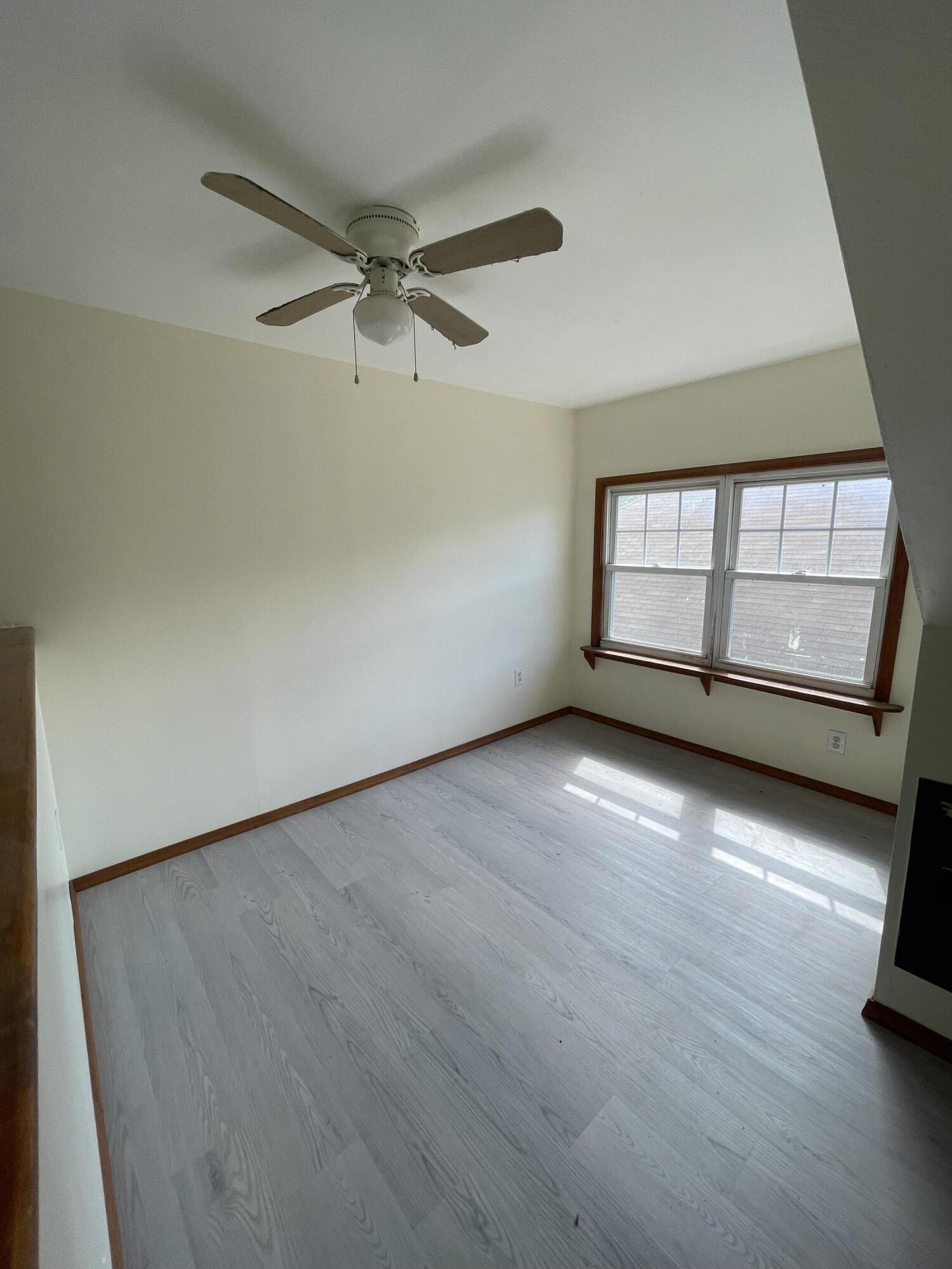 1664 West Main Street Stroudsburg, PA 18360 - Photo 23 of 29 an empty room with wooden floor and windows