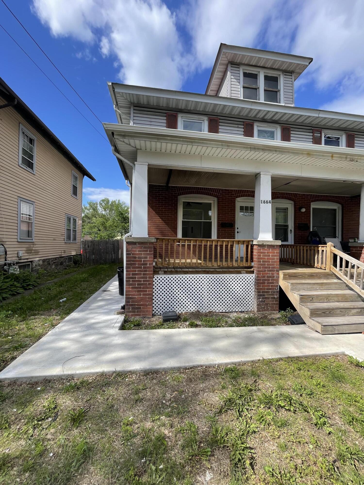 1664 West Main Street Stroudsburg, PA 18360 - Photo 3 of 29 a front view of a house with garden