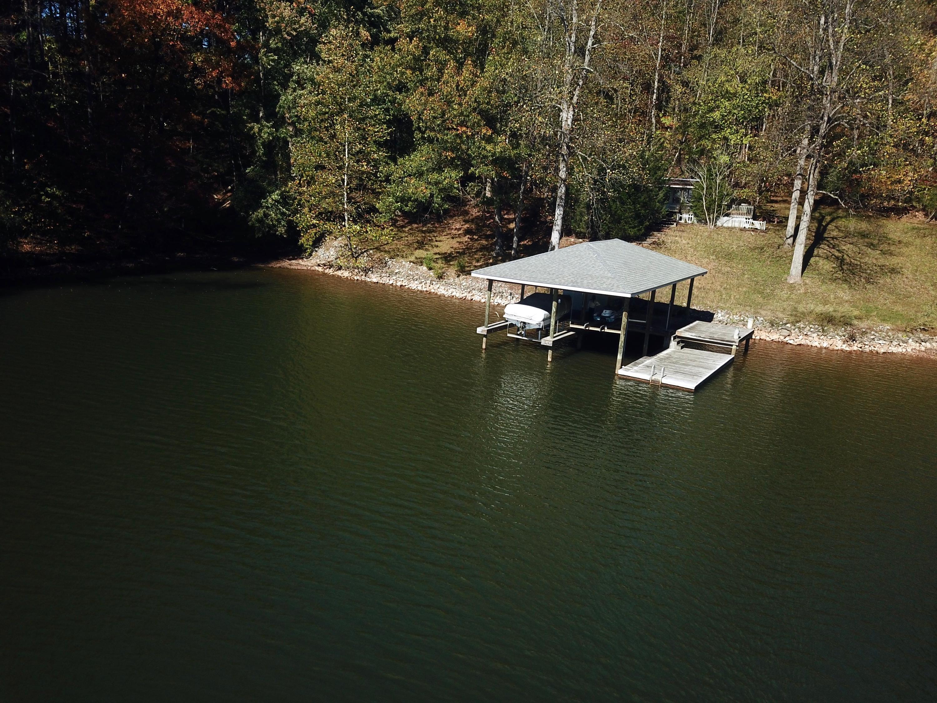 0 Three 3 Quarter Point Road Wirtz, VA 24184 - Photo 18 of 33 a view of a swimming pool with an outdoor space and seating area