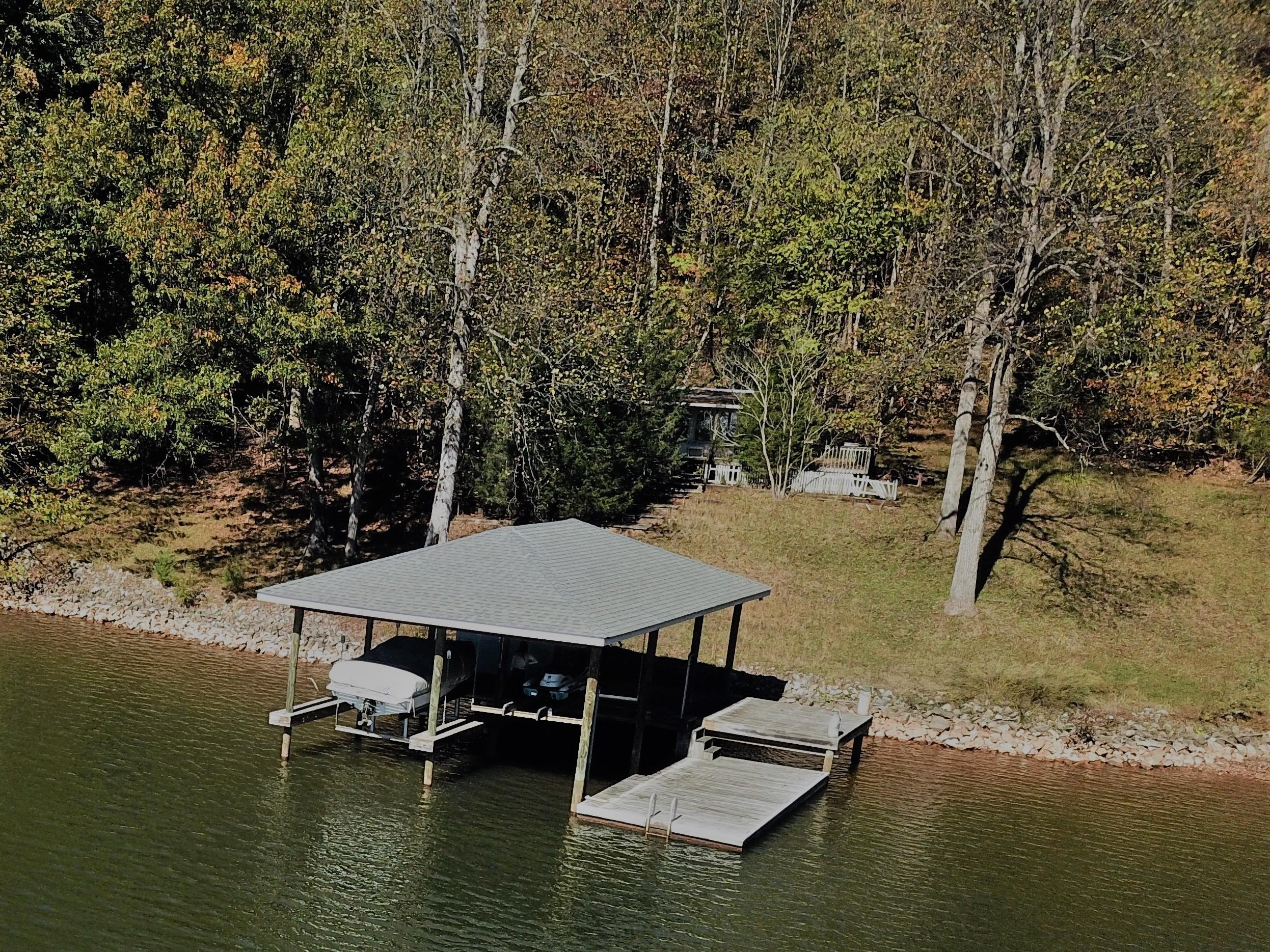 0 Three 3 Quarter Point Road Wirtz, VA 24184 - Photo 24 of 33 a view of a lake with furniture