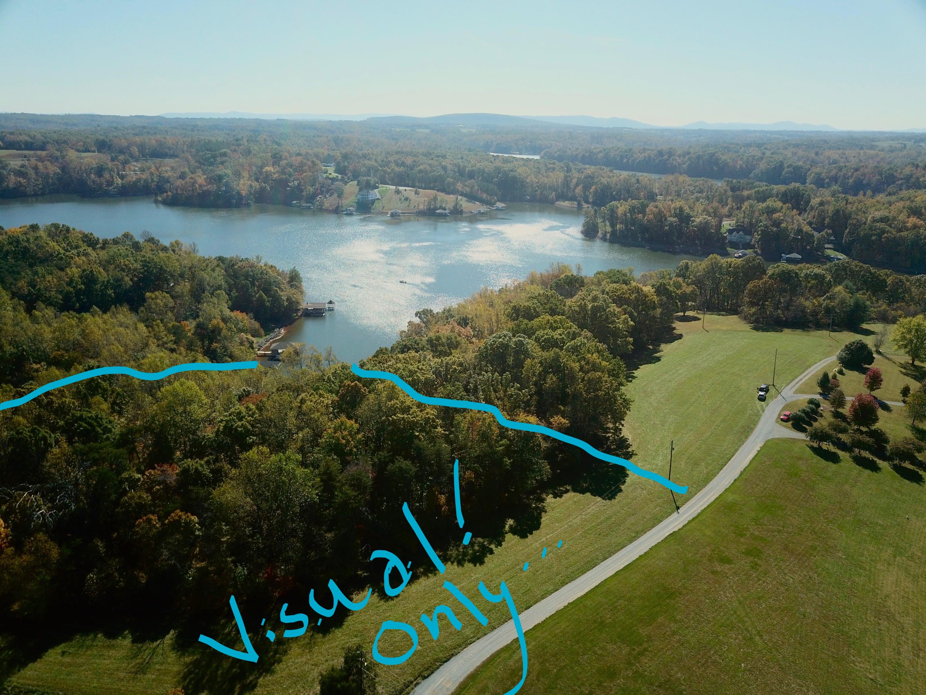 0 Three 3 Quarter Point Road Wirtz, VA 24184 - Photo 3 of 33 an aerial view of a house with a lake view