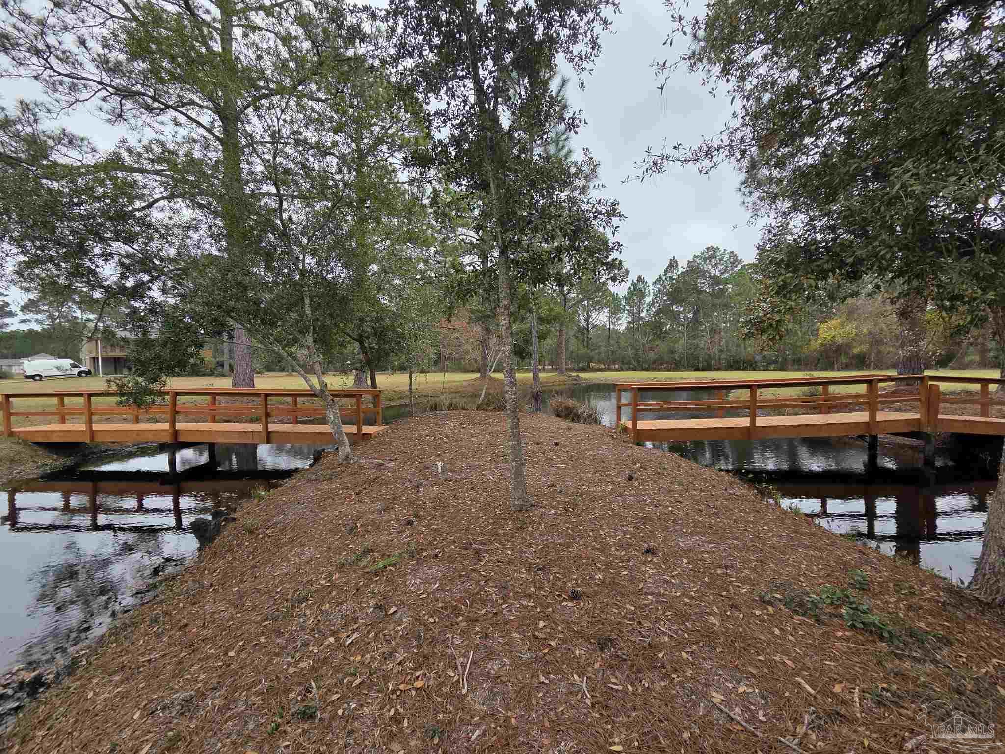 1164 Pearson Road, Unit LOT 2 Milton, FL 32583 - Photo 16 of 25 a view of a park with chairs in the patio