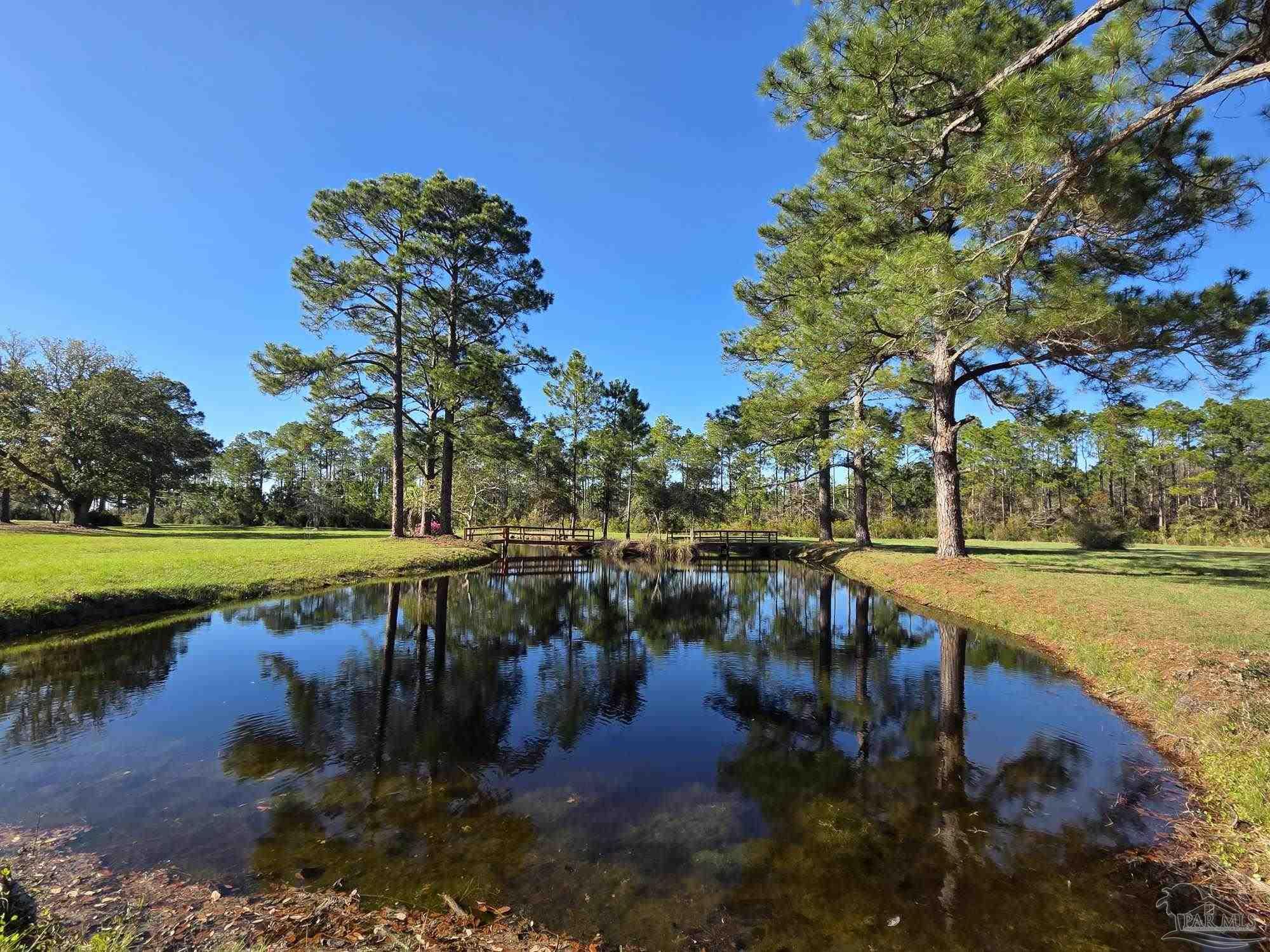 1164 Pearson Road, Unit LOT 2 Milton, FL 32583 - Photo 18 of 25 a view of a lake with houses