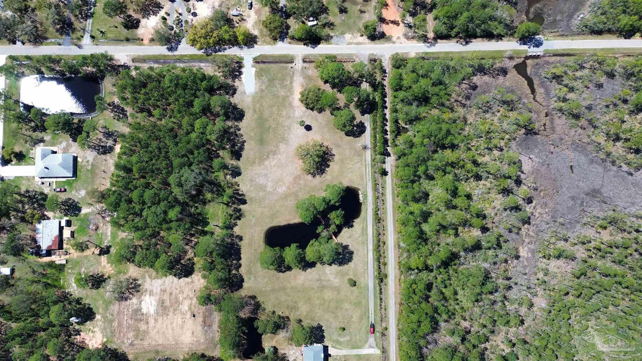 1164 Pearson Road, Unit LOT 2 Milton, FL 32583 - Photo 21 of 25 an aerial view of a house with a yard