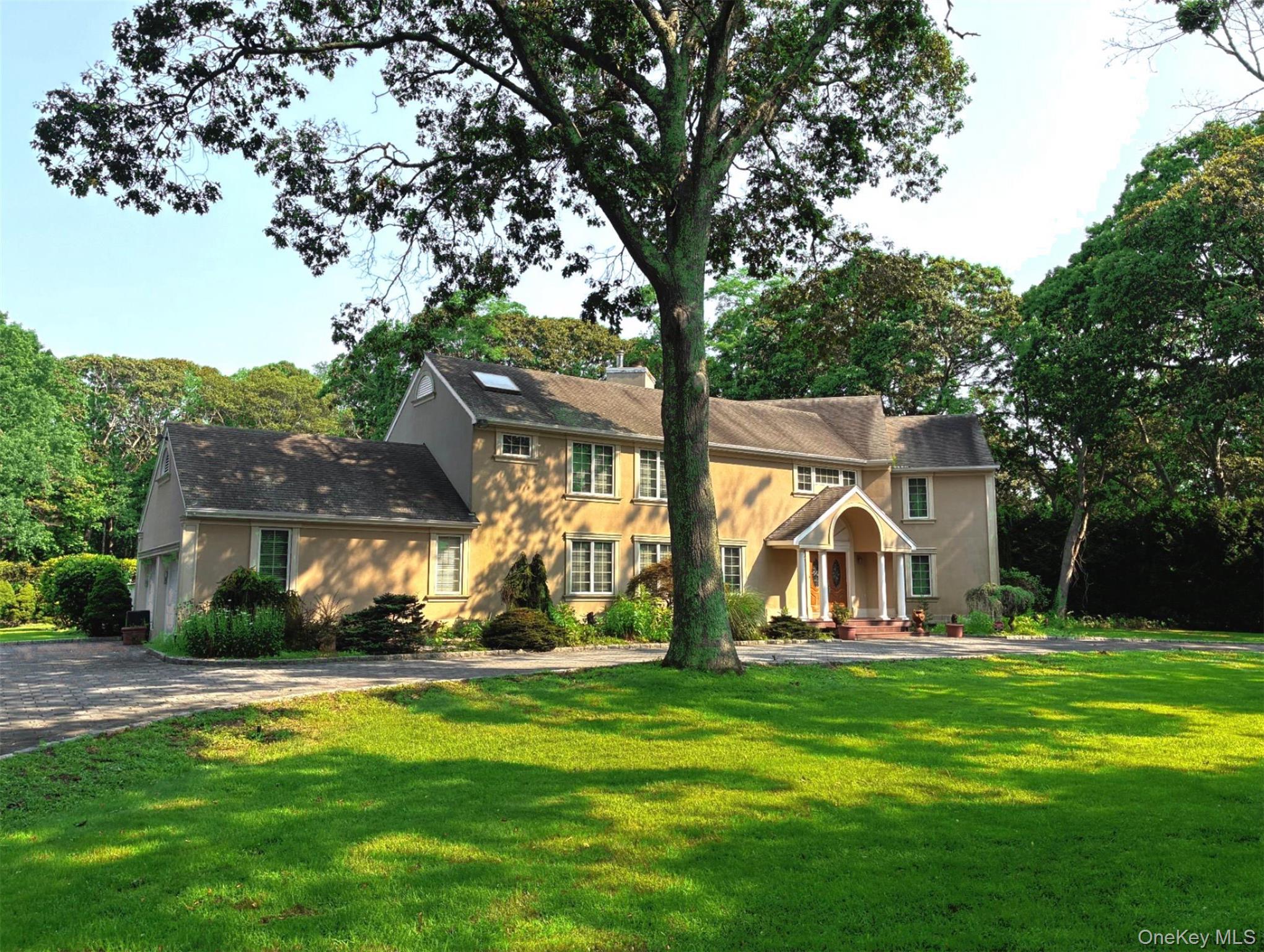 37 Inlet View Path East Moriches, NY 11940 - Photo 1 of 1 a view of a white house with a big yard and large trees