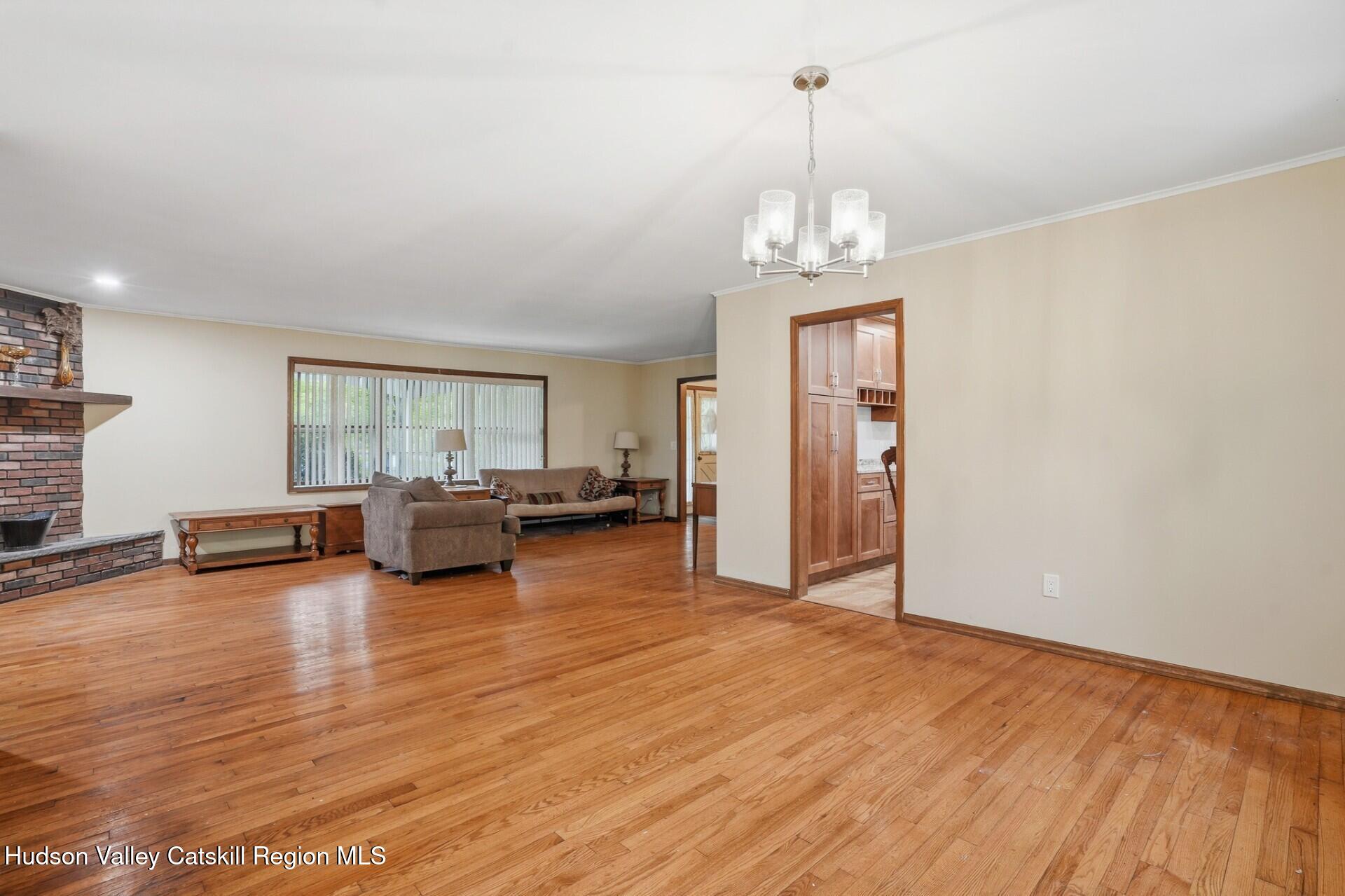 984 Blue Mountain Road Saugerties, NY 12477 - Photo 8 of 24 a view of a livingroom with furniture wooden floor and windows
