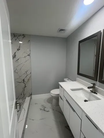 a view of hallway with stainless steel door