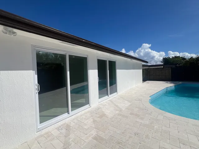 a view of a backyard of the house
