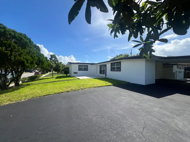 a house view with a garden space