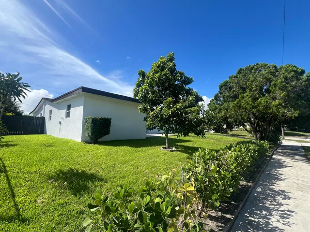 a house with trees in the background