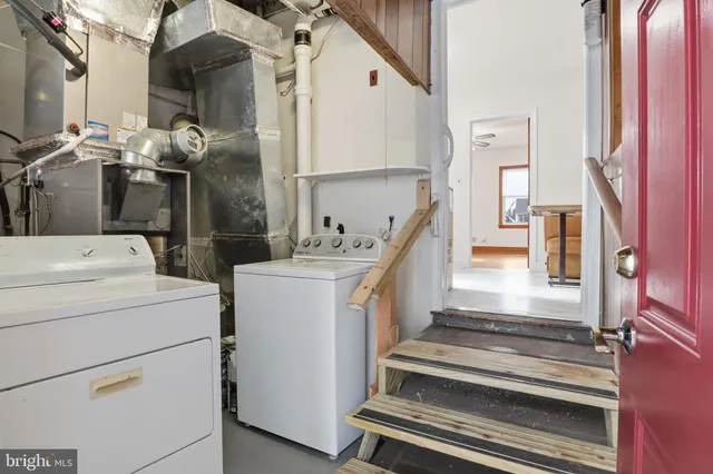 a view of kitchen and hall with wooden floor