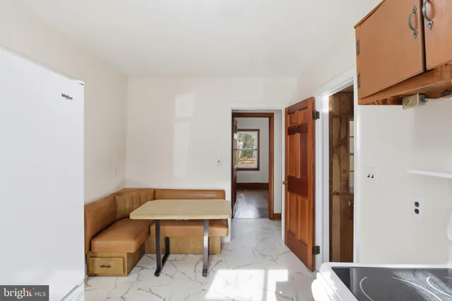 a balcony with table and chairs