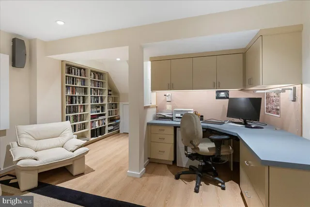 a workspace with furniture and a window