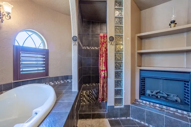 a white bath tub sitting in a bathroom