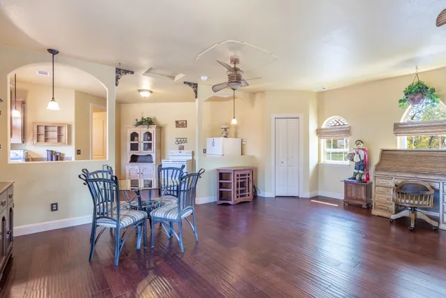 a view of a dining room with furniture window and wooden floor