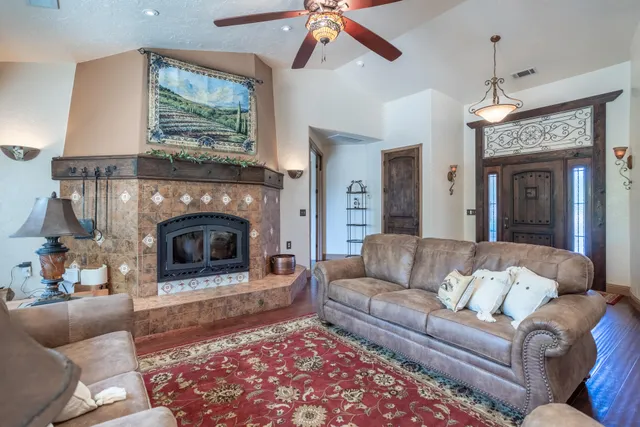 a living room with furniture and a fireplace