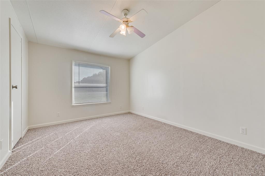 817 Kaufman Street Rosser, TX 75158 - Photo 15 of 29 an empty room with windows and fan