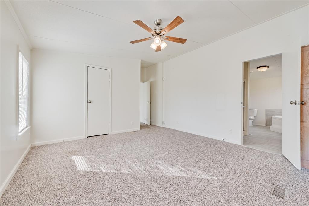 817 Kaufman Street Rosser, TX 75158 - Photo 20 of 29 a view of an empty room with a ceiling fan