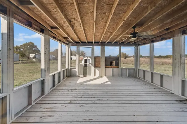a view of a balcony with wooden floor