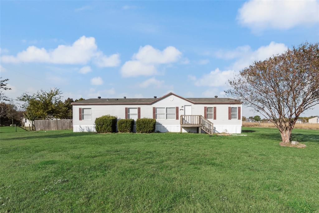 817 Kaufman Street Rosser, TX 75158 - Photo 3 of 29 a view of a house with a yard