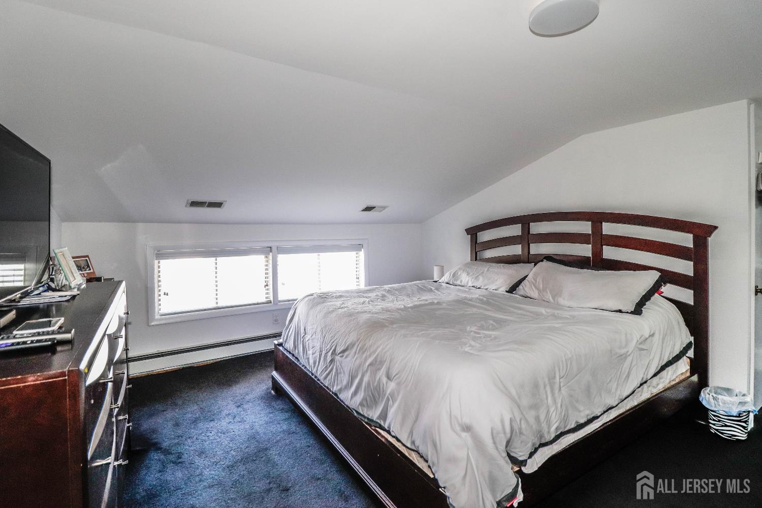 76 Daniel Street Carteret, NJ 07008 - Photo 21 of 37 a bedroom with a bed and a window
