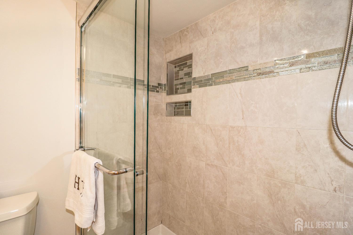 76 Daniel Street Carteret, NJ 07008 - Photo 24 of 37 a bathroom with a shower and a toilet