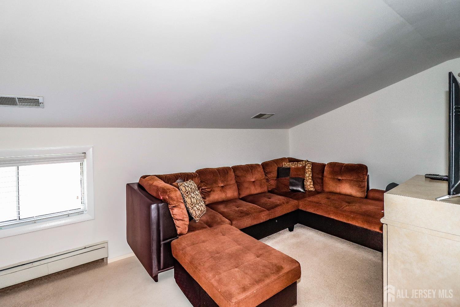 76 Daniel Street Carteret, NJ 07008 - Photo 25 of 37 a living room with furniture and a window