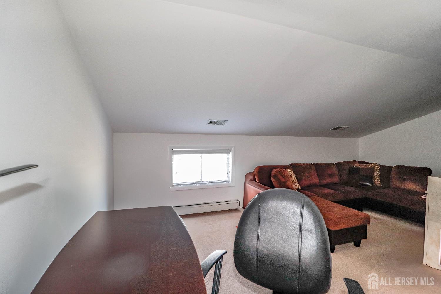 76 Daniel Street Carteret, NJ 07008 - Photo 26 of 37 a view of a livingroom with furniture and windows