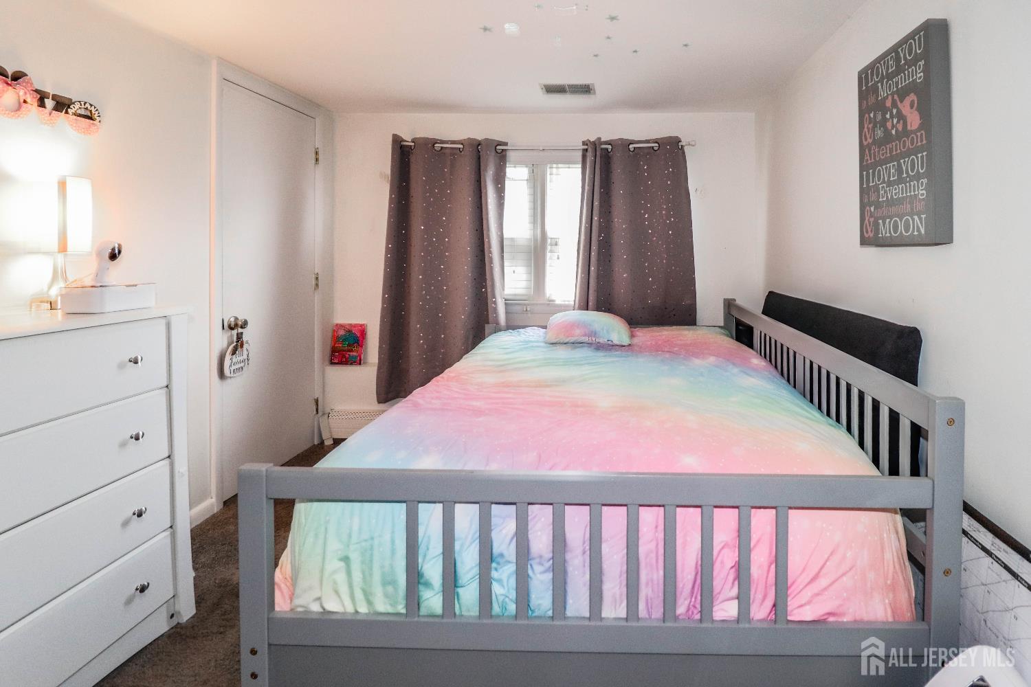 76 Daniel Street Carteret, NJ 07008 - Photo 28 of 37 a bedroom with a bed and a window