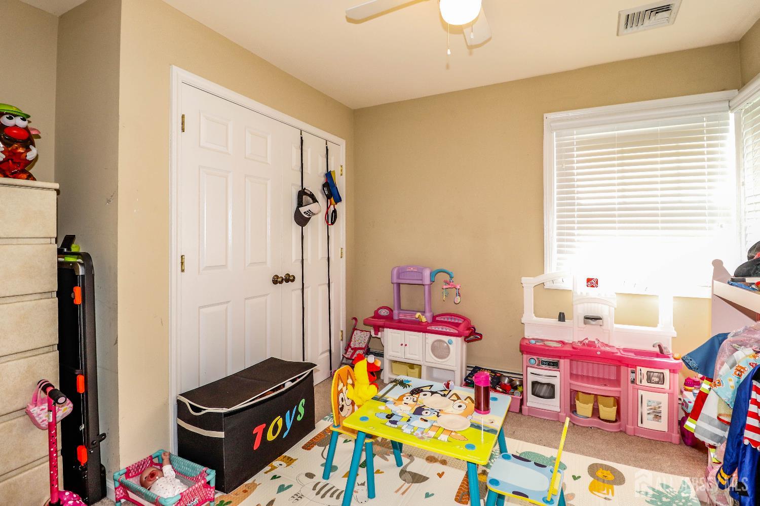 76 Daniel Street Carteret, NJ 07008 - Photo 29 of 37 a playing room with toys and a wooden floor