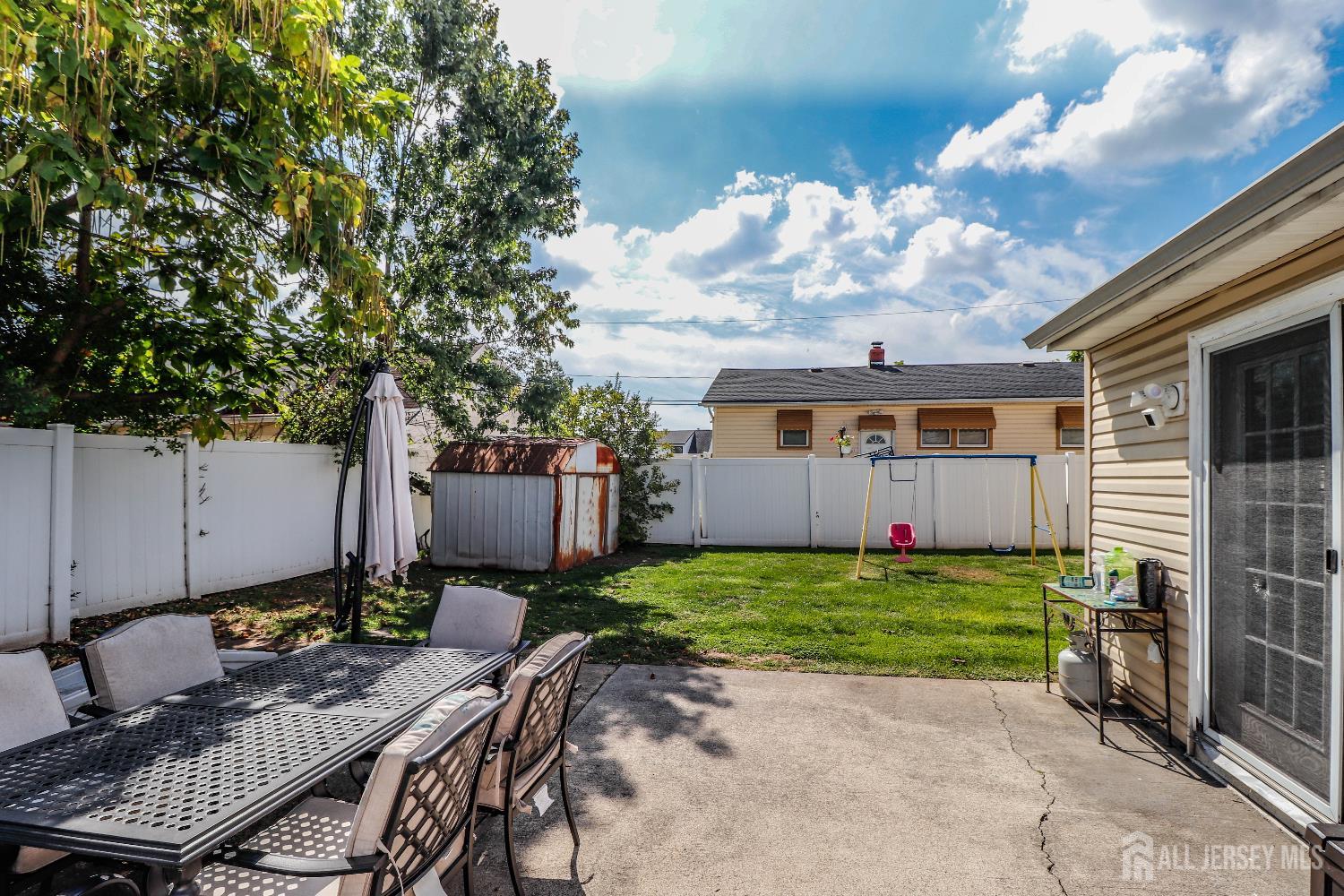 76 Daniel Street Carteret, NJ 07008 - Photo 30 of 37 a view of a house with backyard and sitting area