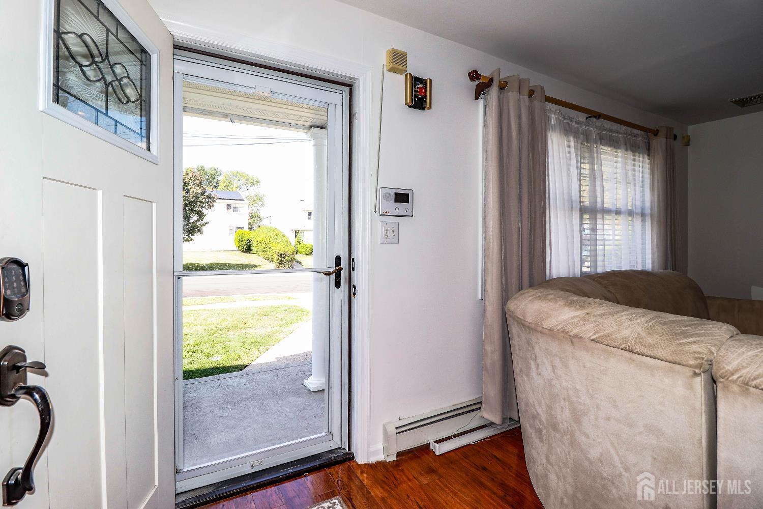 76 Daniel Street Carteret, NJ 07008 - Photo 4 of 37 a room with window washer and dryer