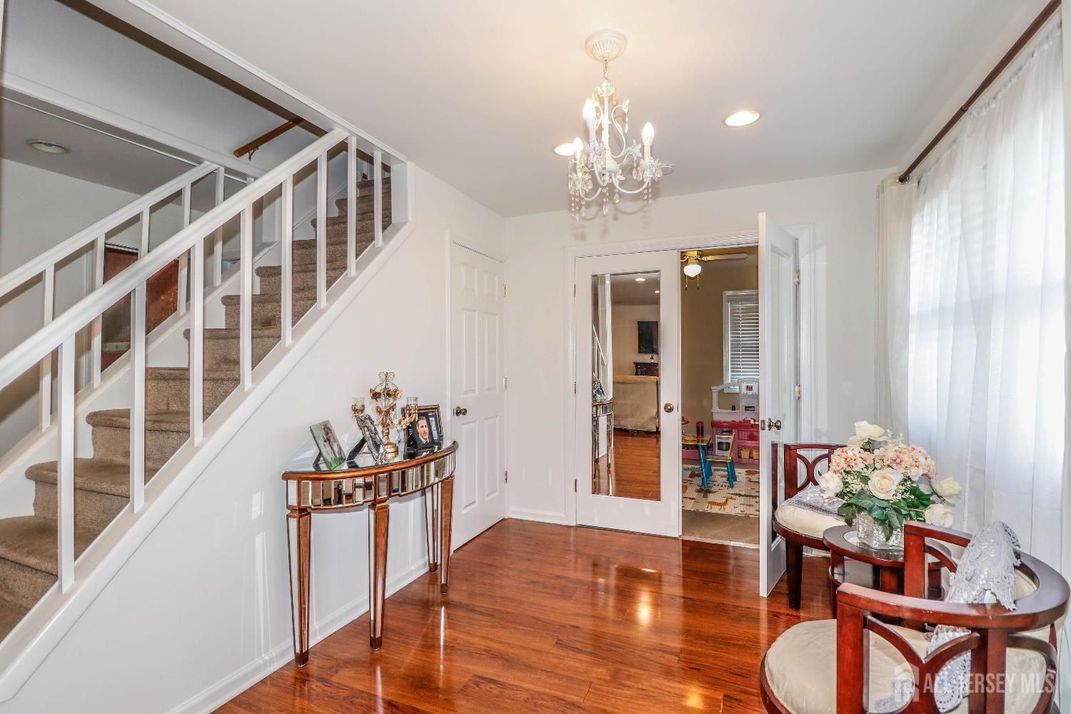76 Daniel Street Carteret, NJ 07008 - Photo 5 of 37 a view of a room with wooden floor and furniture