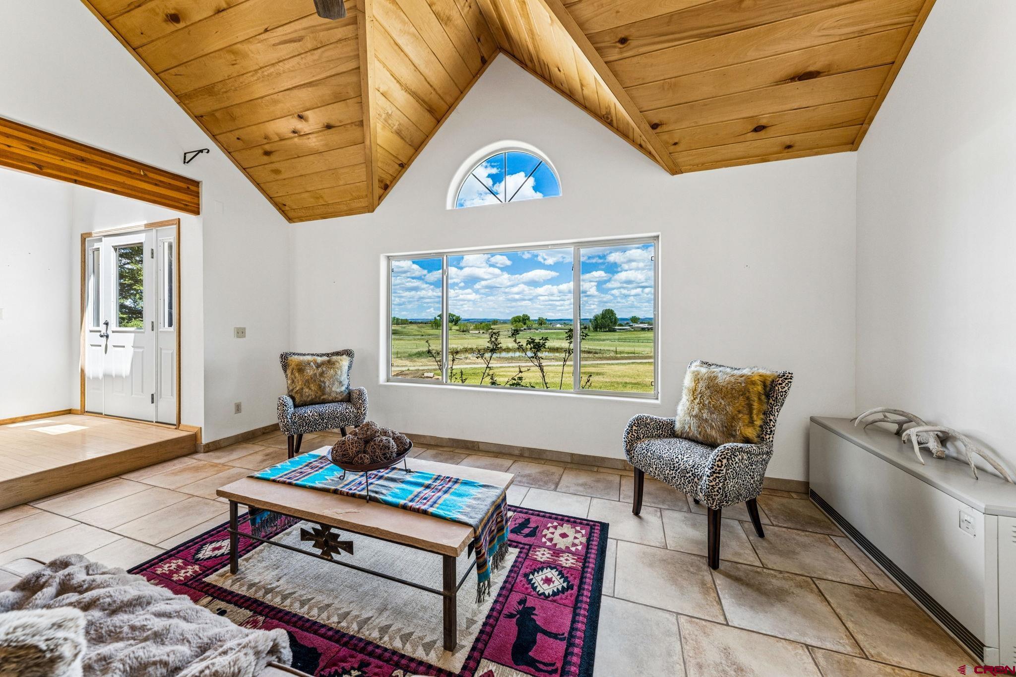 22480 Rd L Cortez, CO 81321 - Photo 4 of 44 a living room with furniture a rug and a window