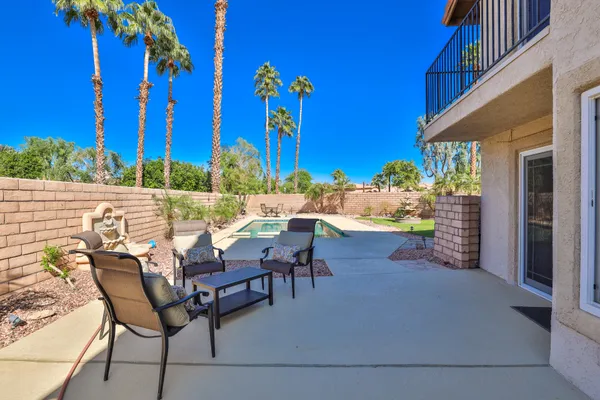 a view of a chairs and tables in the patio