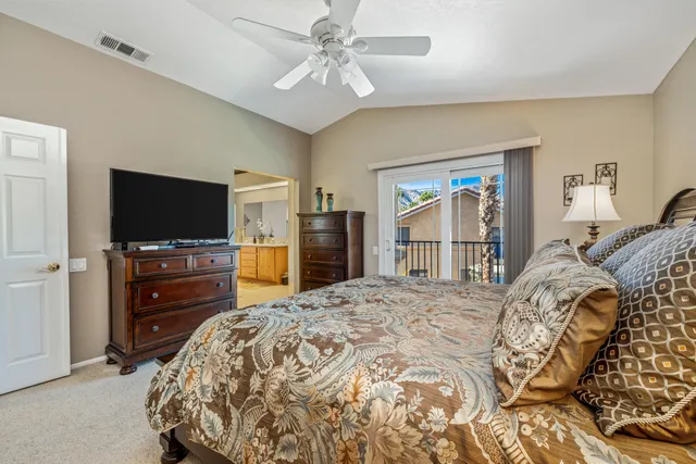 a spacious bathroom with a shower sink and mirror