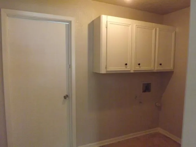 a view of a small house with a balcony