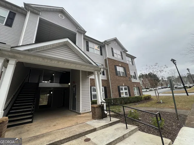 a front view of a house with stairs