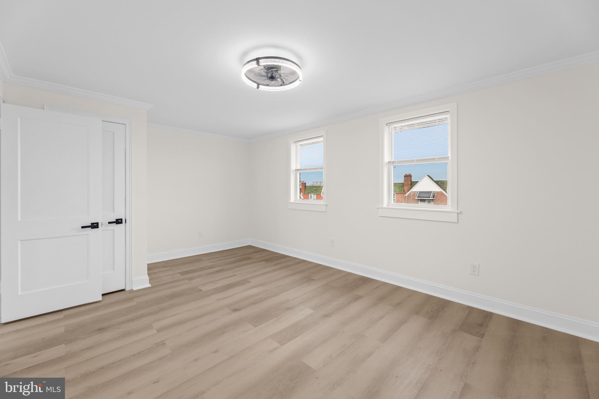 7920 Provident Street Philadelphia, PA 19150 - Photo 25 of 32 a view of an empty room with wooden floor and a window