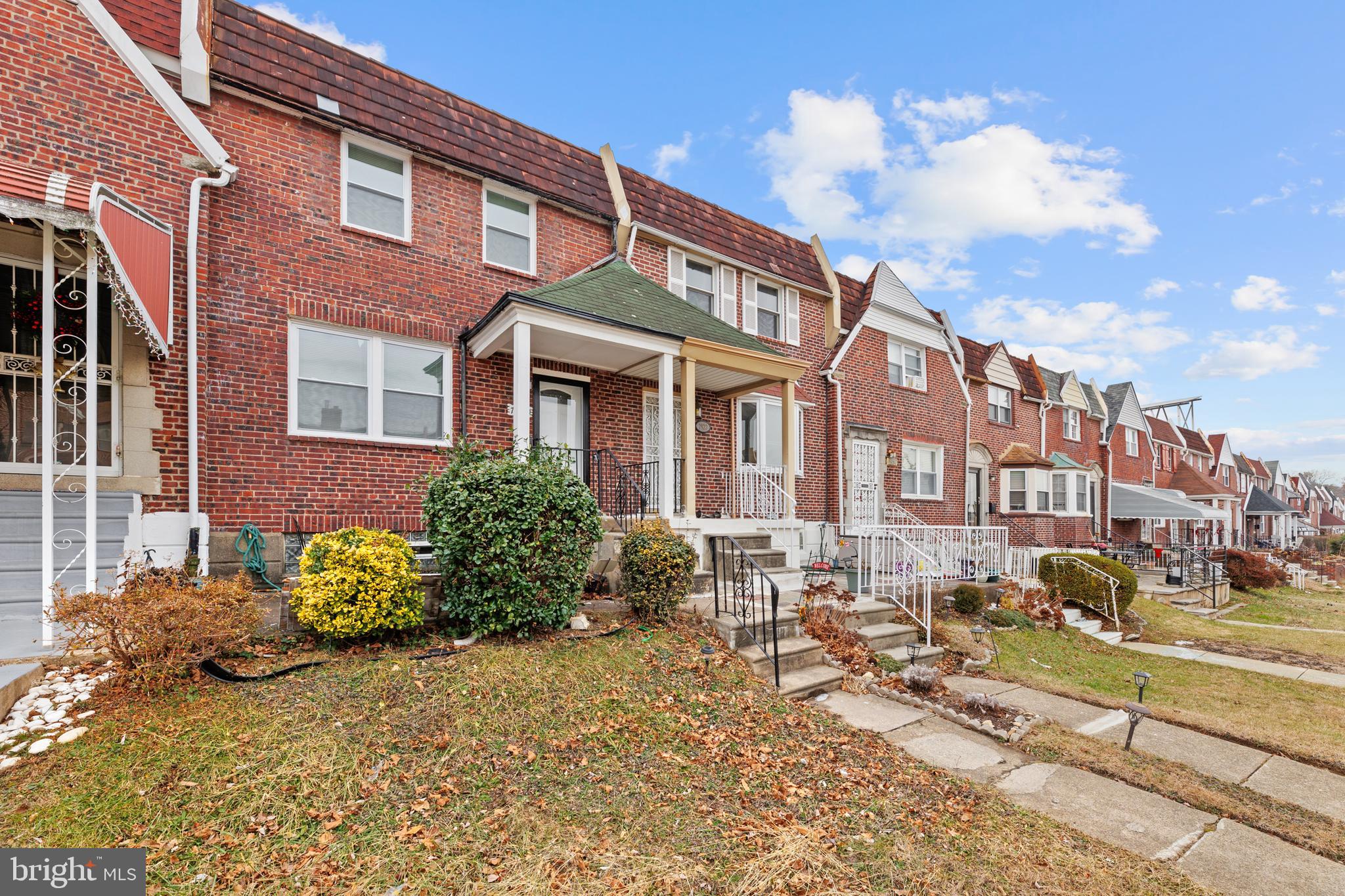 7920 Provident Street Philadelphia, PA 19150 - Photo 6 of 32 a front view of a house with yard and seating area