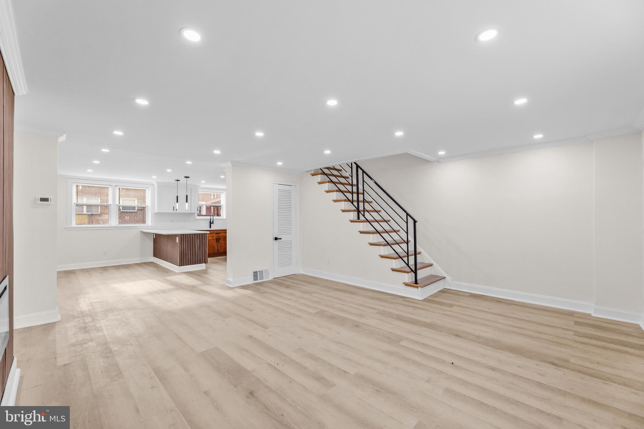 7920 Provident Street Philadelphia, PA 19150 - Photo 8 of 32 a view of an empty room with wooden floor and windows