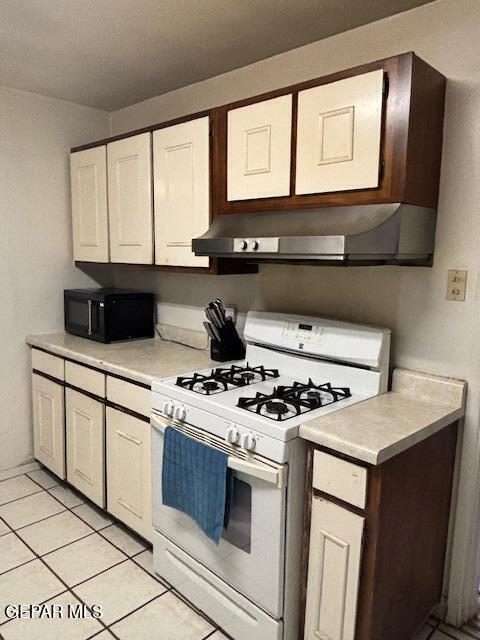 133 Baywood Road El Paso, TX 79915 - Photo 19 of 30 a kitchen with stainless steel appliances granite countertop a stove a sink and a microwave