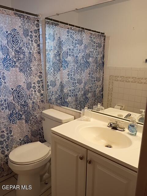 133 Baywood Road El Paso, TX 79915 - Photo 27 of 30 a bathroom with a sink a toilet and a shower