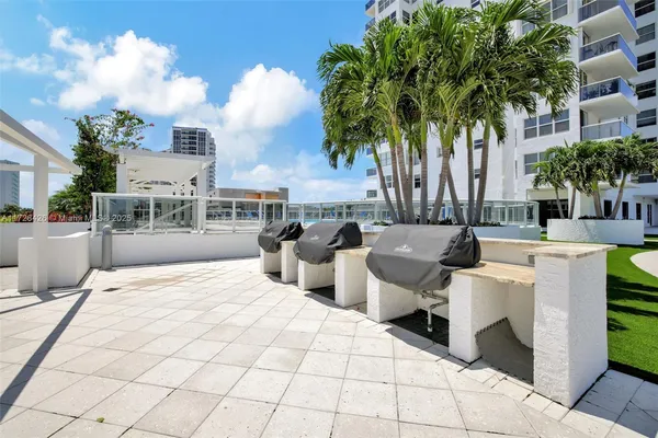 a view of a building with a backyard