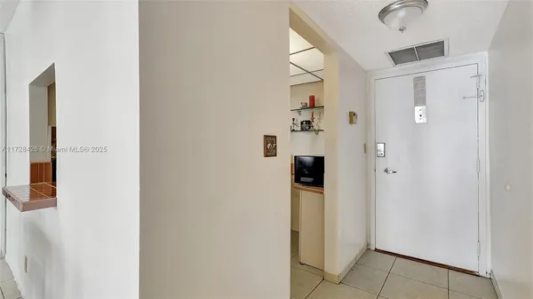 a bathroom with a shower and a sink