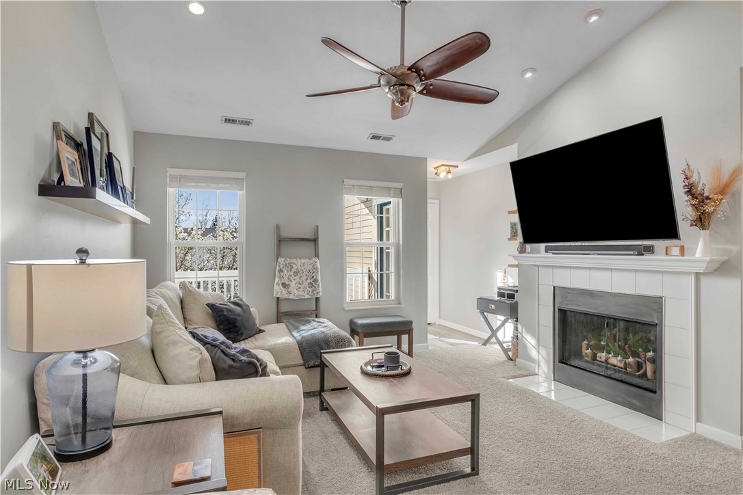 28340 Center Ridge Road, Unit 124 Westlake, OH 44145 - Photo 6 of 37 Living area featuring a ceiling fan, light colored carpet, a fireplace, recessed lighting, and lofted ceiling
