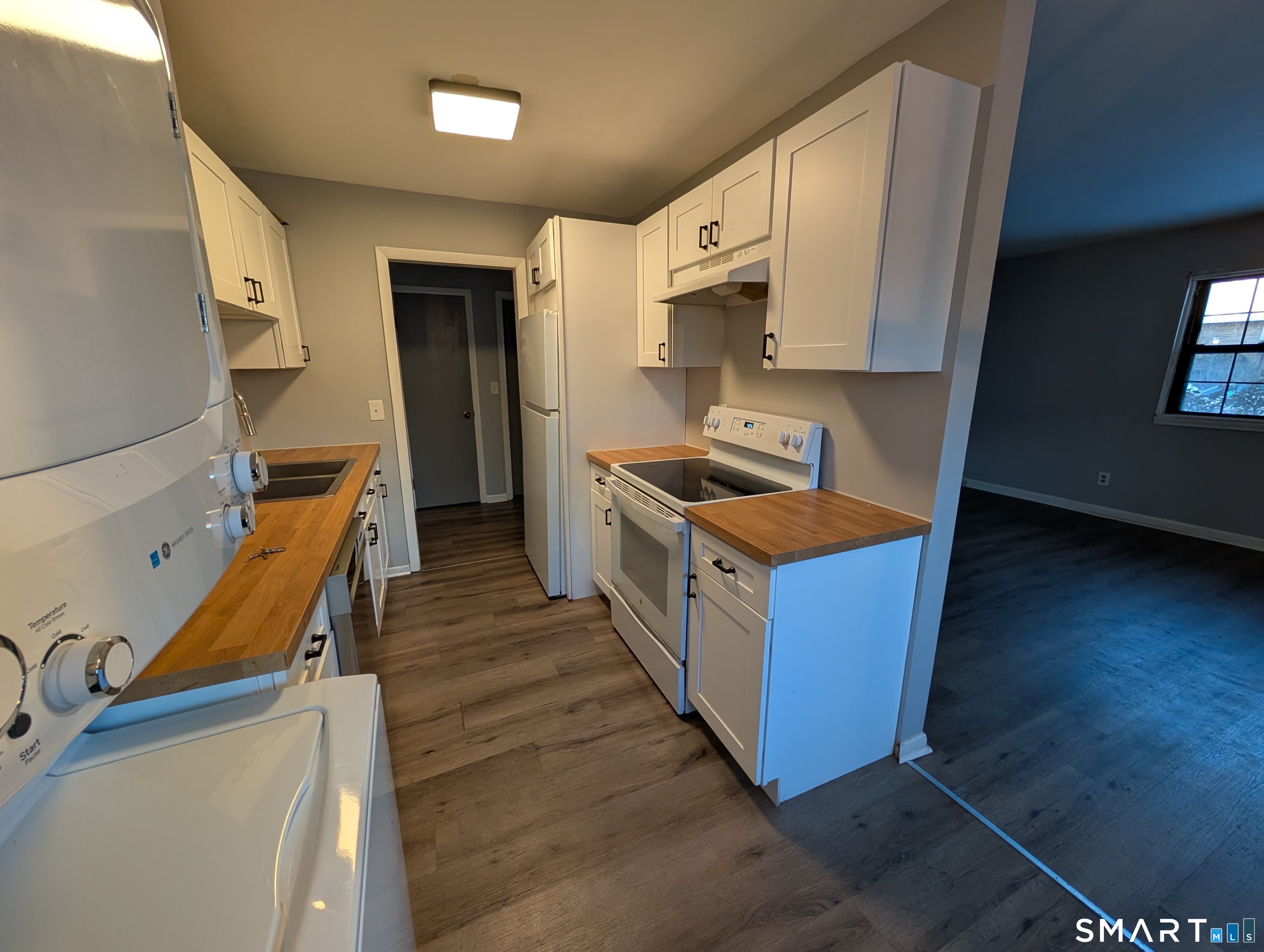 21 Enid Street, Unit A Bridgeport, CT 06606 - Photo 1 of 10 a kitchen with stainless steel appliances granite countertop a stove a sink and a refrigerator