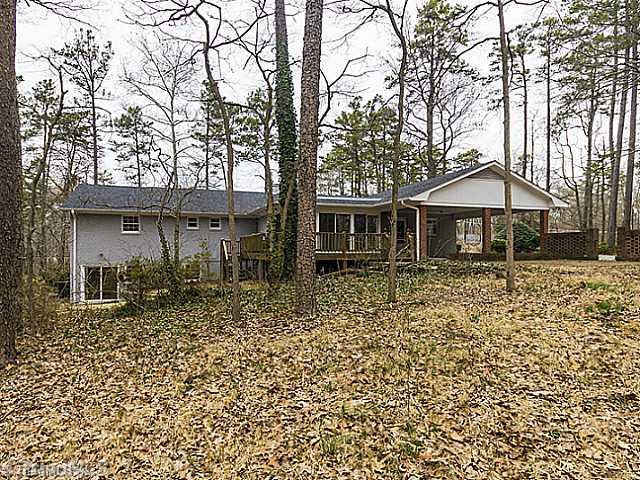 5609 Scotland Road Greensboro, NC 27407 - Photo 16 of 16 Exterior Front. Screened Porch Deck walk out Patio from Basement