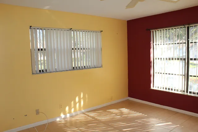 a view of an empty room with a window