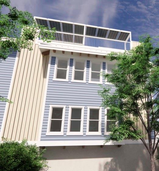 20 Outlook Way, Unit 7 Dunedin, FL 34698 - Photo 27 of 33 a front view of a house with a yard and garage